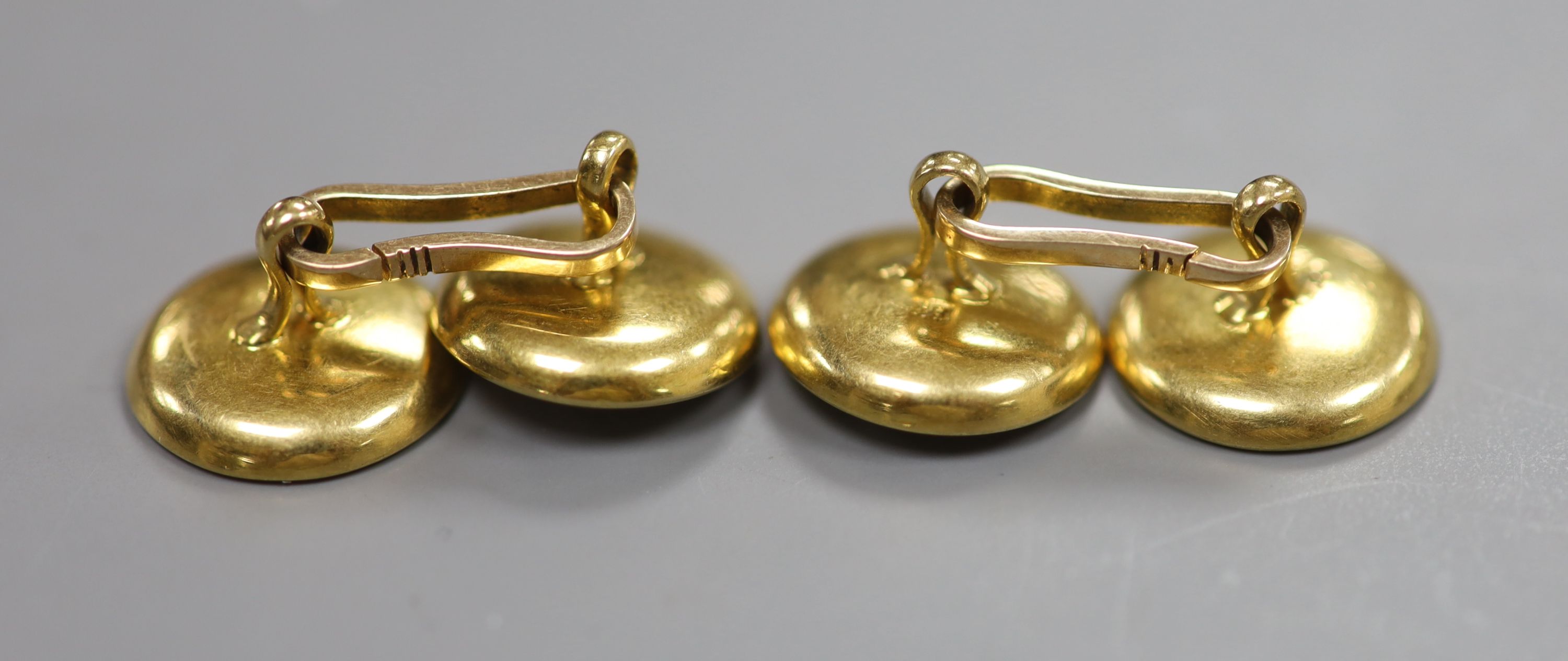 A pair of yellow metal(stamped 18), mother of pearl and seed pearl set disc cufflinks( 2 pearls missing), 14mm, gross 8.7 grams.